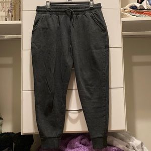 Dark gray joggers with drawstring and pockets